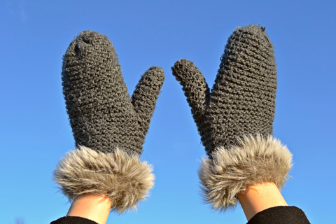 Woman wearing winter gloves to prevent dry skin.