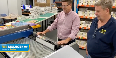 Rob Molhoek MP assembles his first Australian made jigsaw puzzle at QPuzzles Ashmore