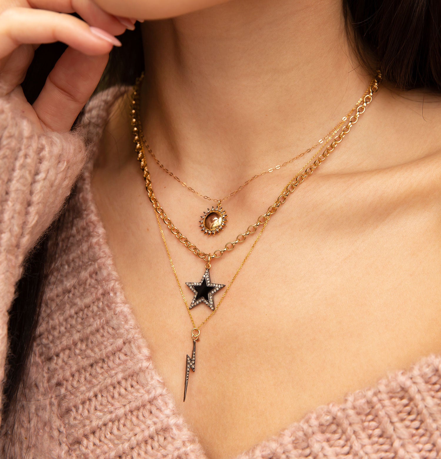 layered star and lightening bolt necklaces.jpeg__PID:80d73965-6763-4b06-bcc0-acb588dcf962