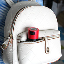 vitavac container in a purse