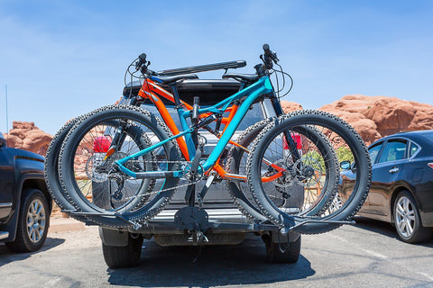 two bikes on back of a car