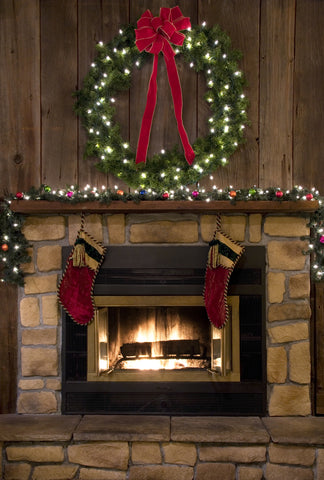 Fire Piece scene with Christmas lit garland and Wreath on top of mantel