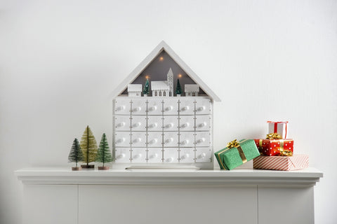 Christmas homemade advent calendar on top of mantel piece