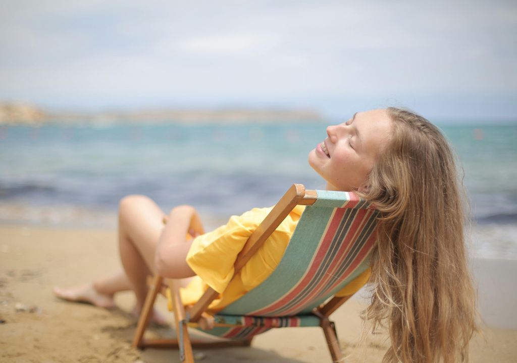 Lady sunbathing at the beach