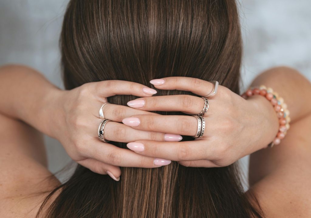 lady smoothing down hair