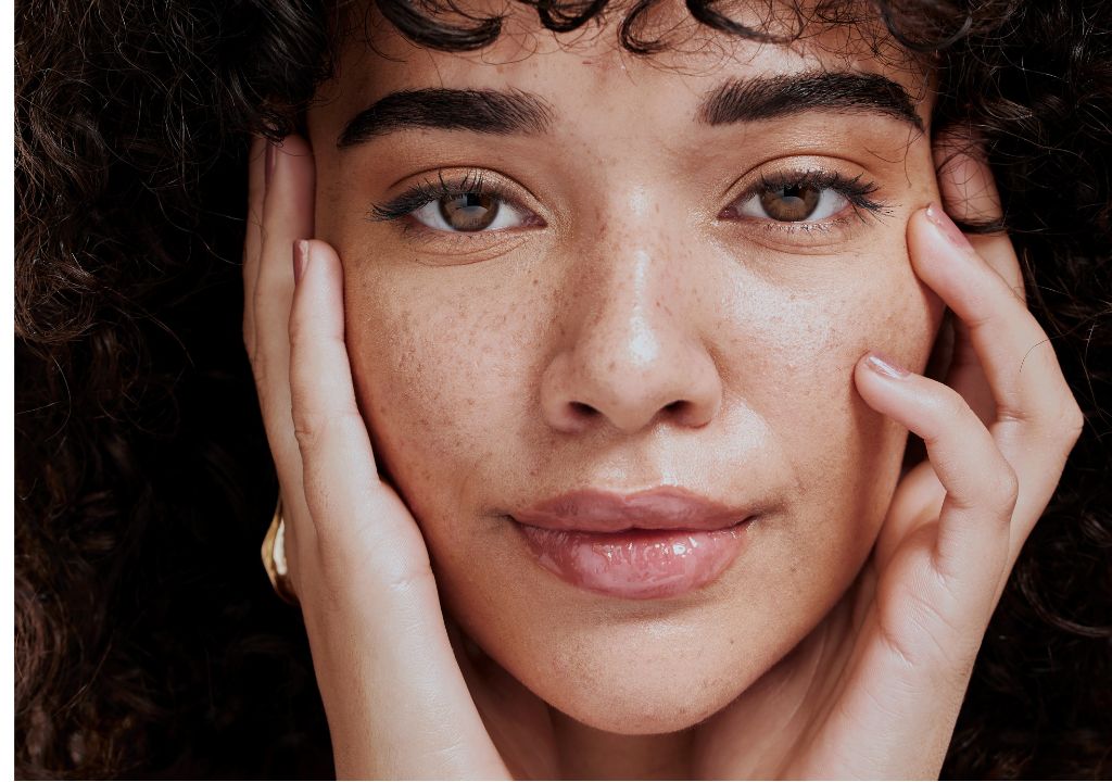 lady with freckles smiling