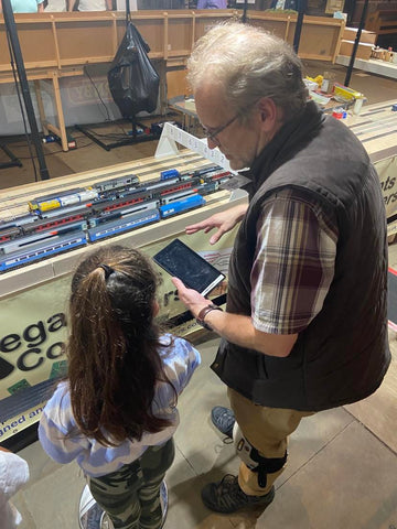 Kids with volunteer at Making Tracks 2