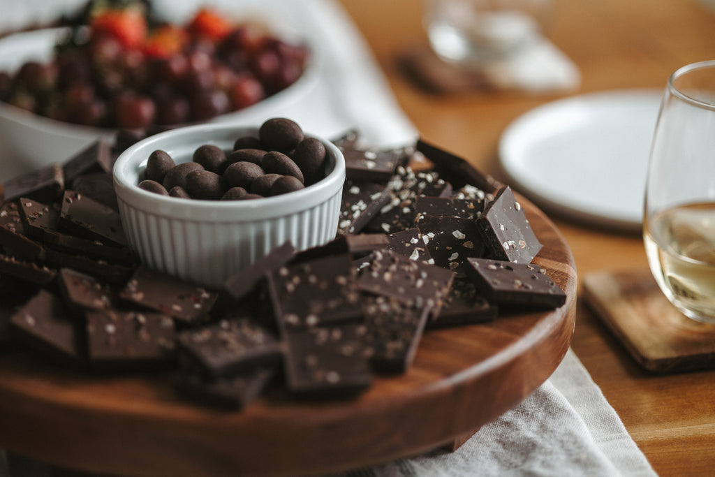 board-of-chocolate-squares-white-bowl-with-almonds