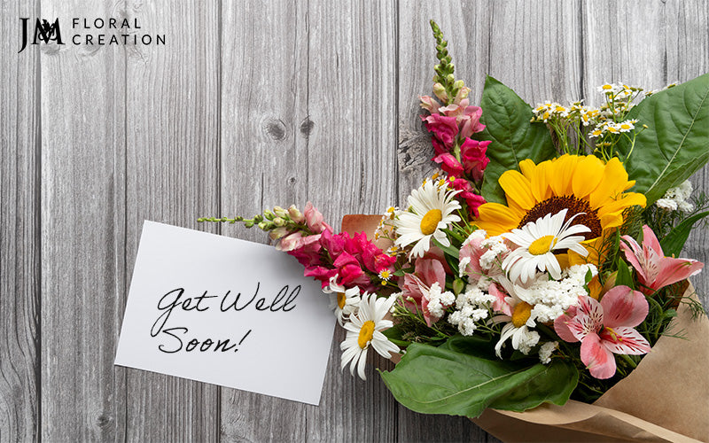 Bouquet with get well soon card on it