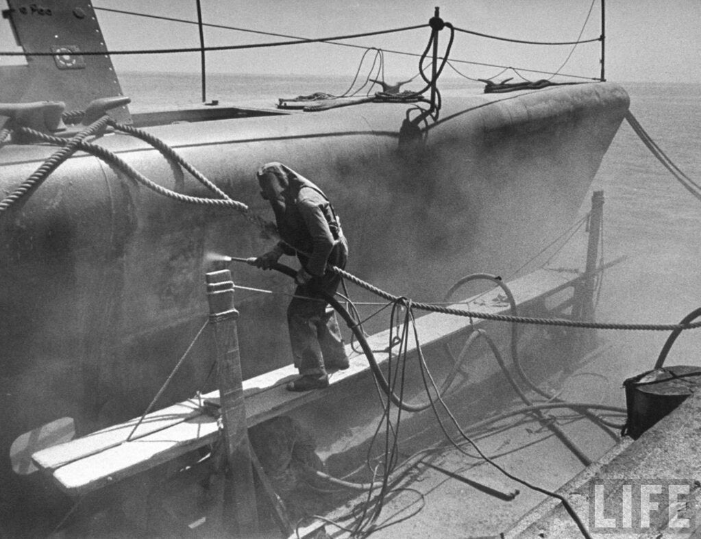 Sandblasting, naval shipyard