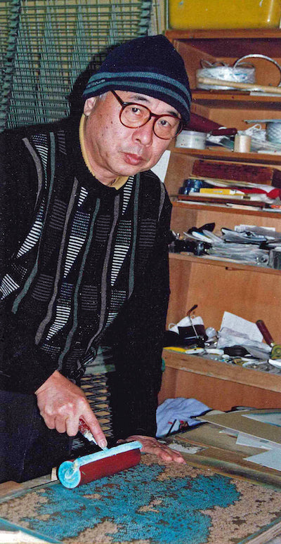 Hajime Namiki in his studio working on Japanese woodblock prints