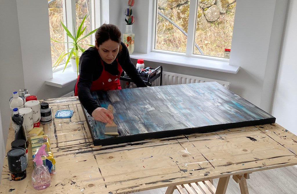 Icelandic abstract artist, Iris Kristmunds, working on a painting