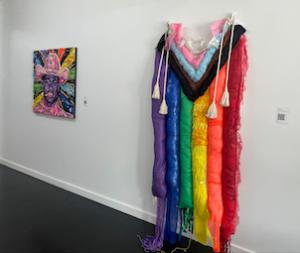 Jason Mecier's Lil Naz X portrait and Nat Saia's rainbow flag fabric quilt "Cinched Margins" at Schlomer Haus Gallery. (photo: JL Odom)