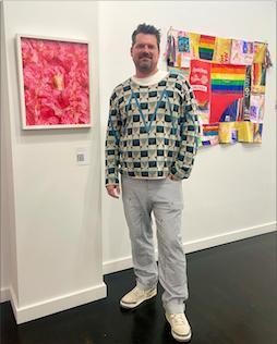 Steffan Schlarb with pink floral art by Marcel Pardo Ariza, "Más Flores Para Nosotres" at Schlomer Haus Gallery. photo: JL Odom