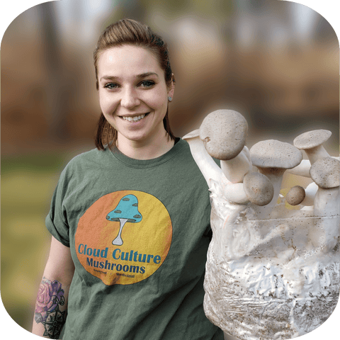 Woman holding king oyster mushrooms