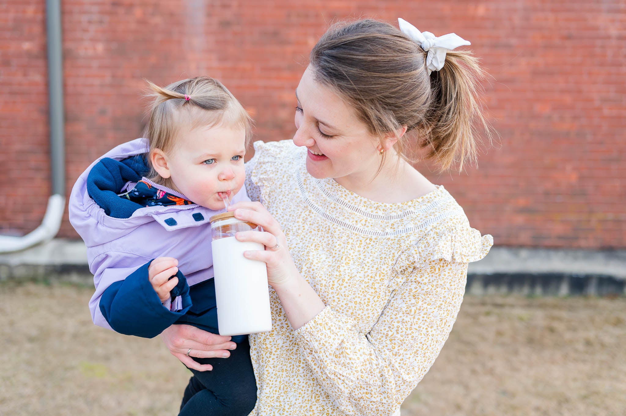 Taryn and Nellie drinking water