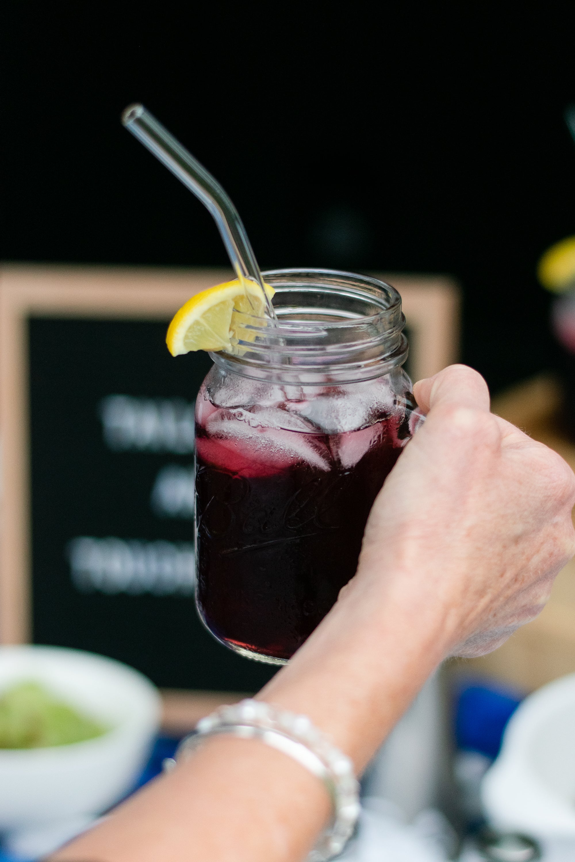 Raspberry lemonade with glass straws