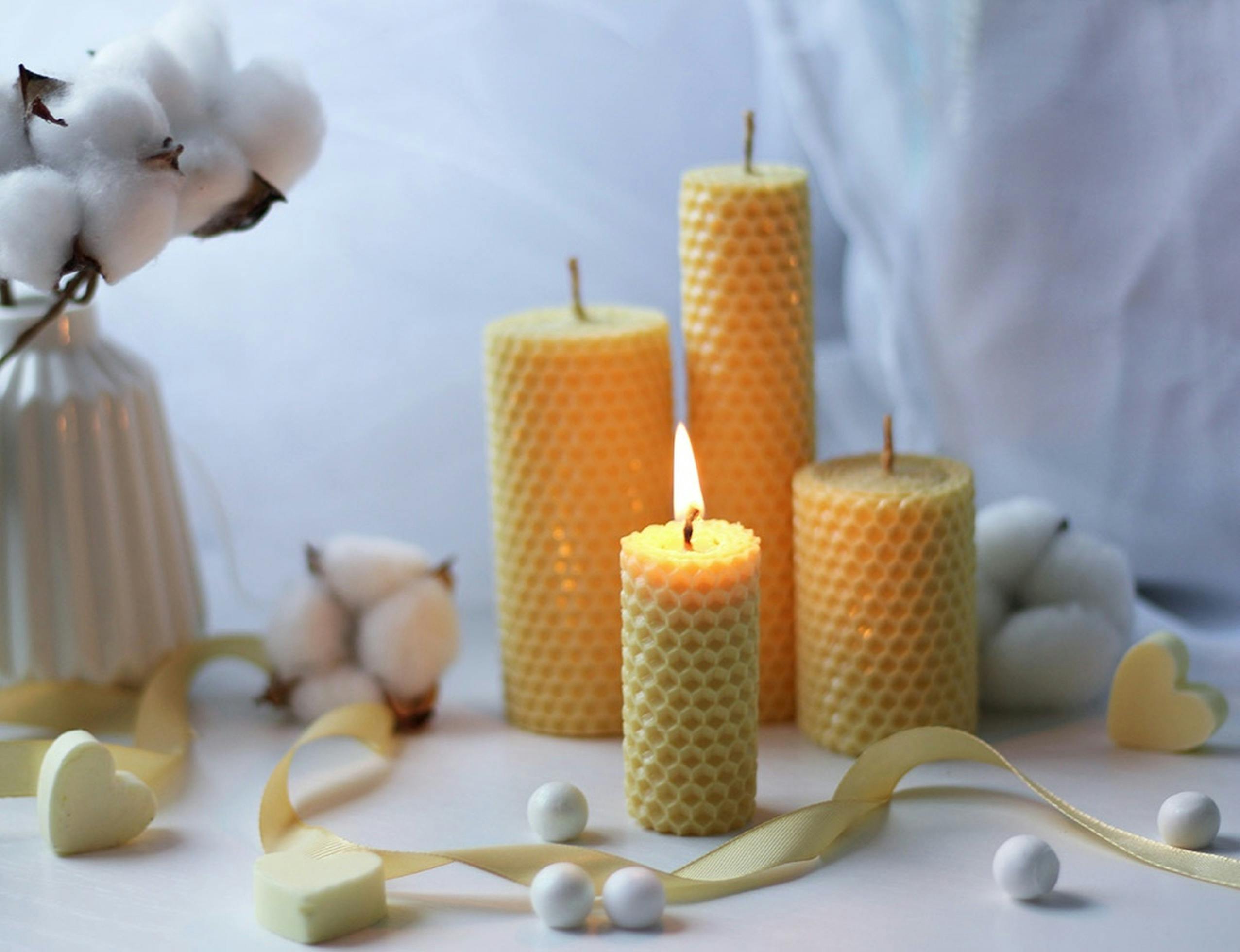 Candles, cotton flowers and ribbon