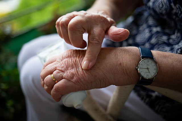 Woman pressing one hand on the other