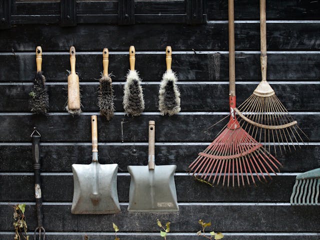 Gardening tools hanging on the wall