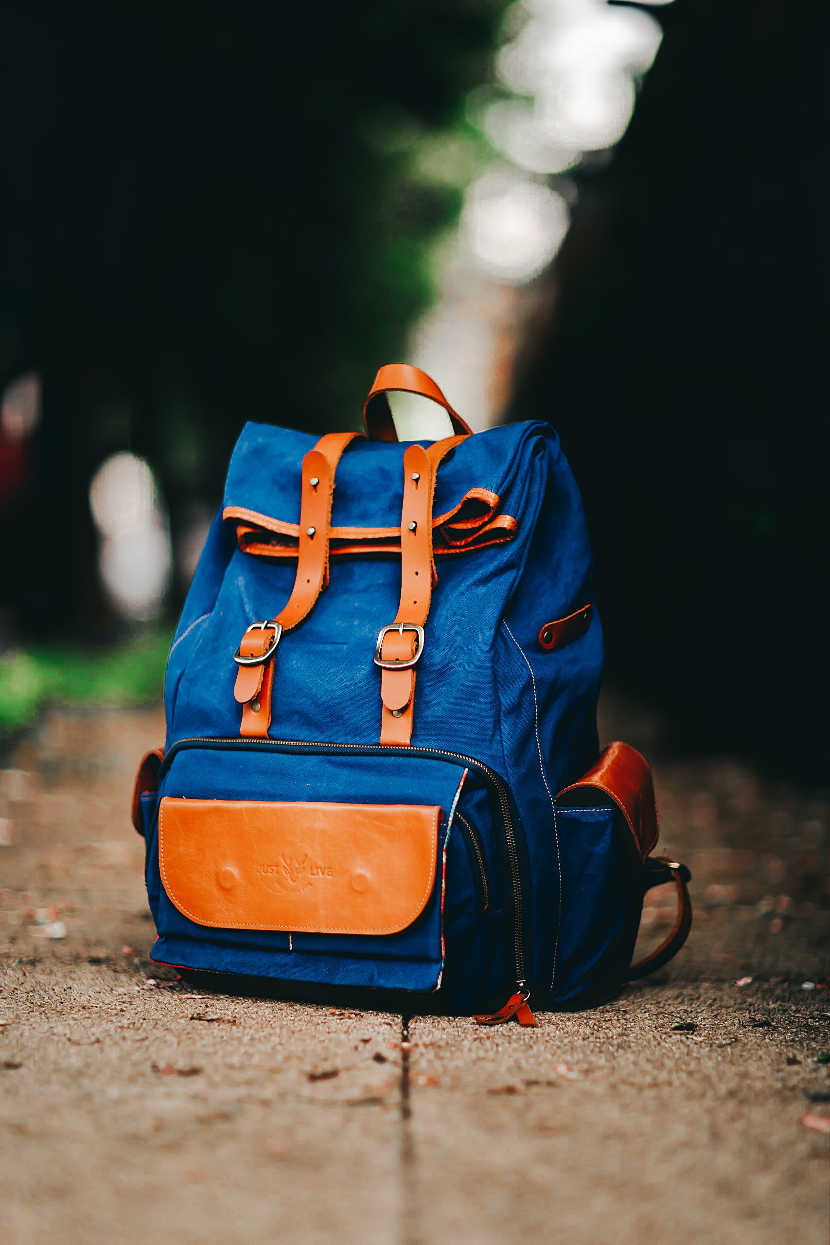  Blue backpack with orange straps and design elements