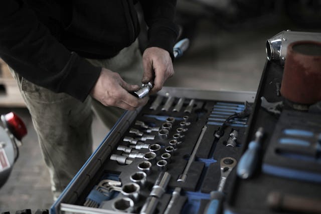 Man near a set of tools