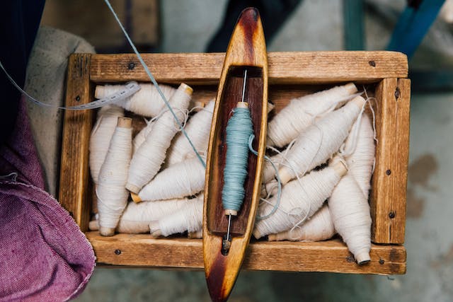 Spools of thread in a wooden box