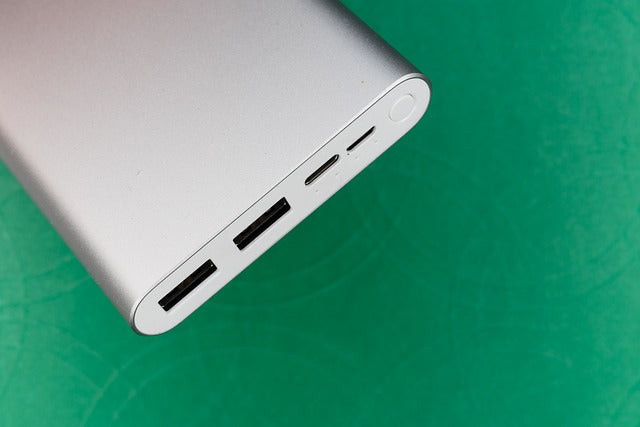 Power bank on green background