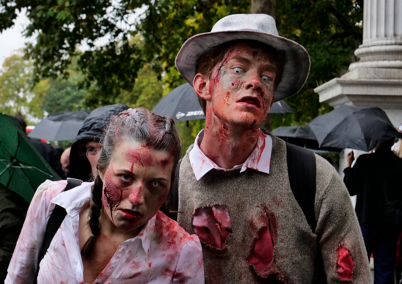 Man and woman in zombie costumes