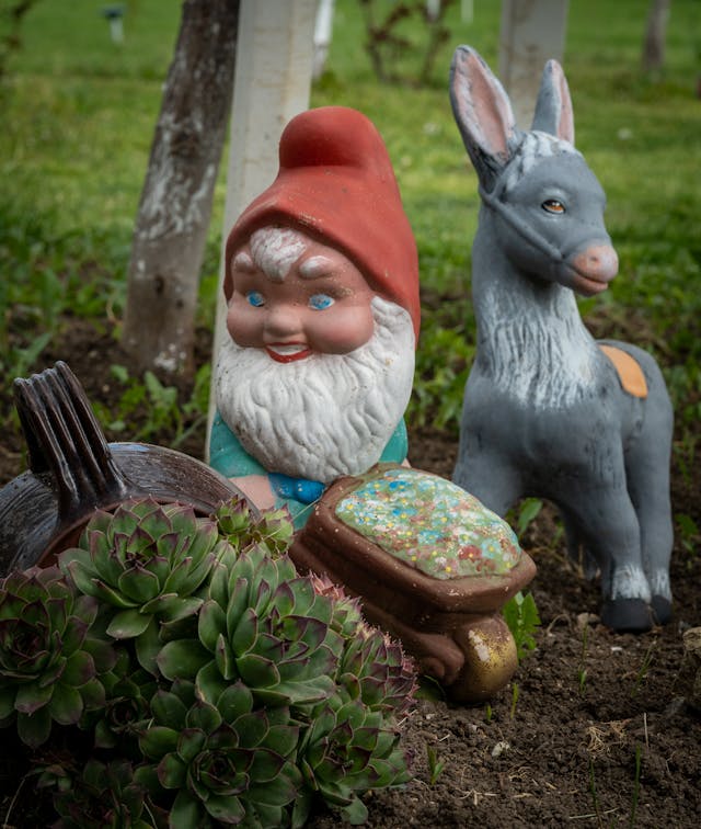 Garden figurines of a gnome and a donkey