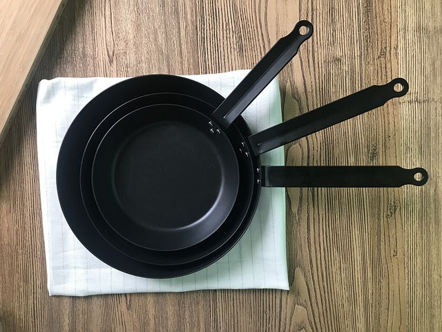 Three pans stacked on top of each other