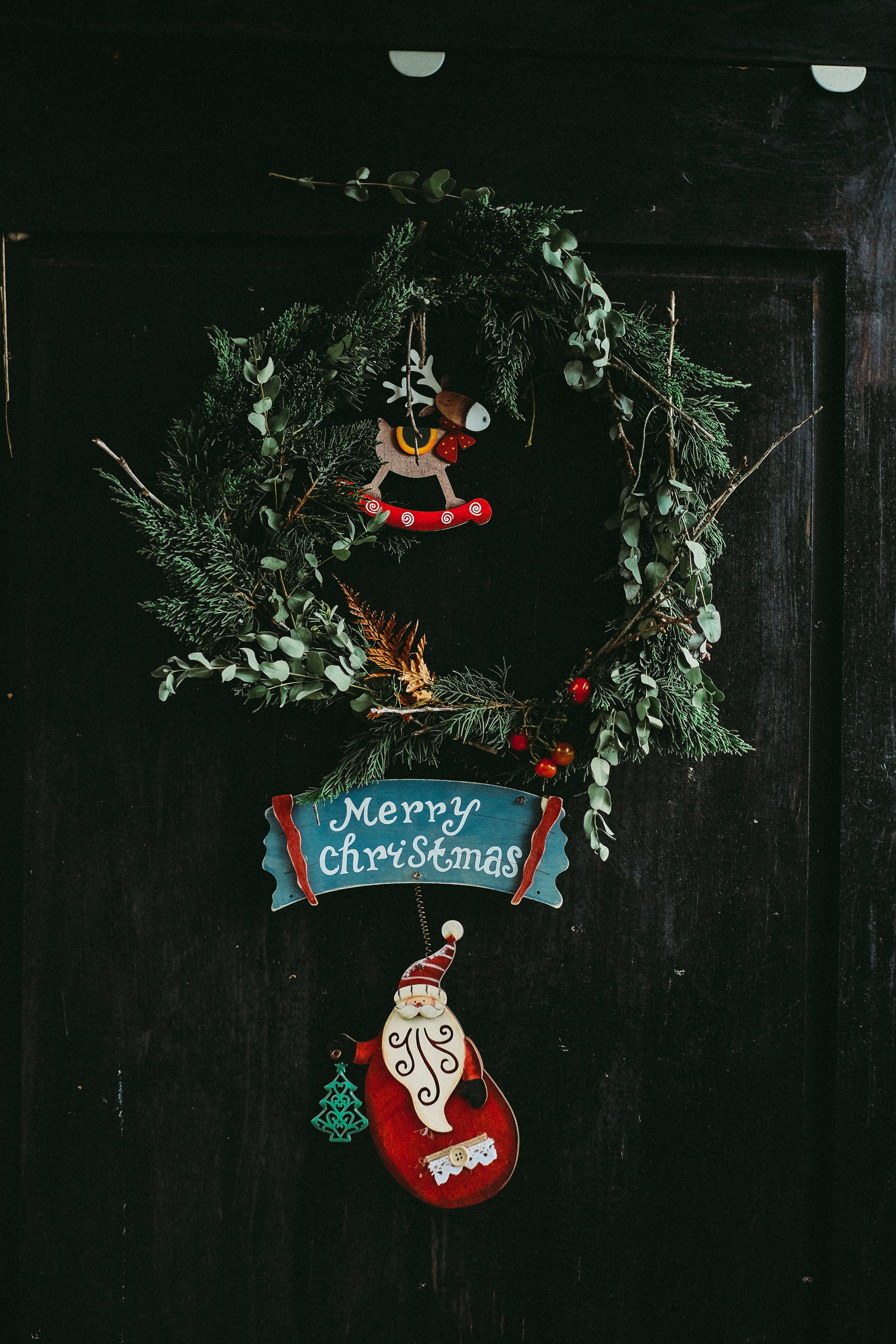 Christmas wreath with Merry Christmas inscription on the door