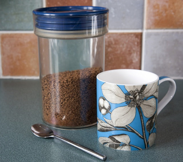 Container with instant coffee, mug and spoon