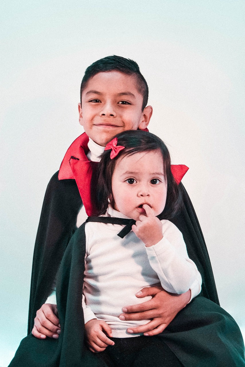 Girl and boy in vampire costumes