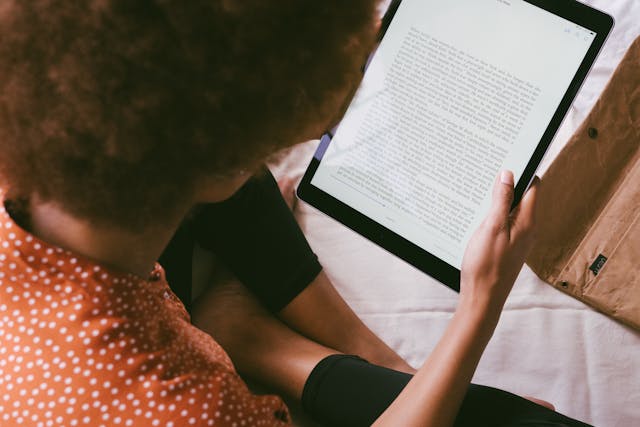 Woman with an e-book in her hands