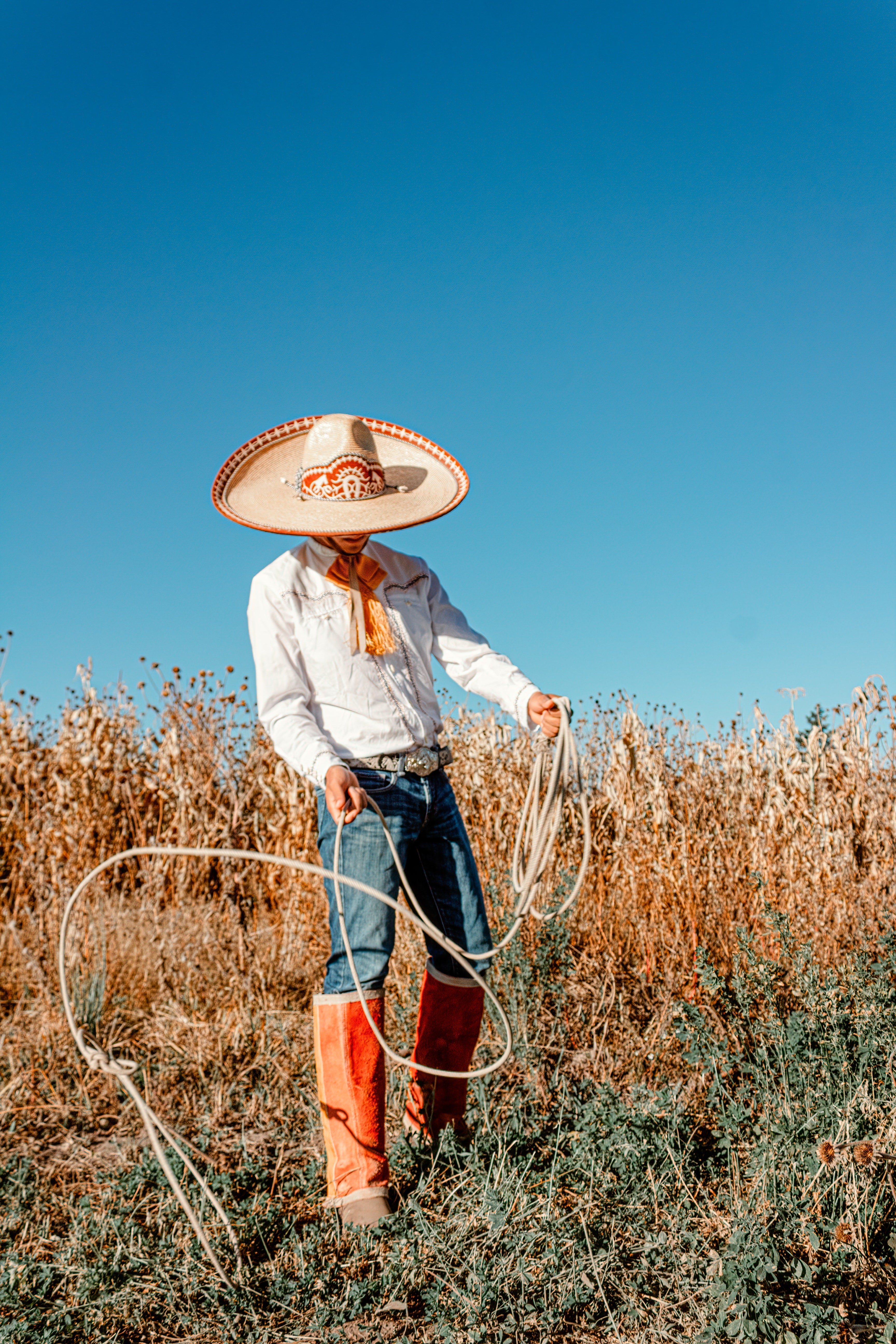 Man in a cowboy costume with a lasso in his hand