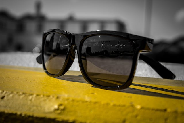 Sunglasses on a yellow surface