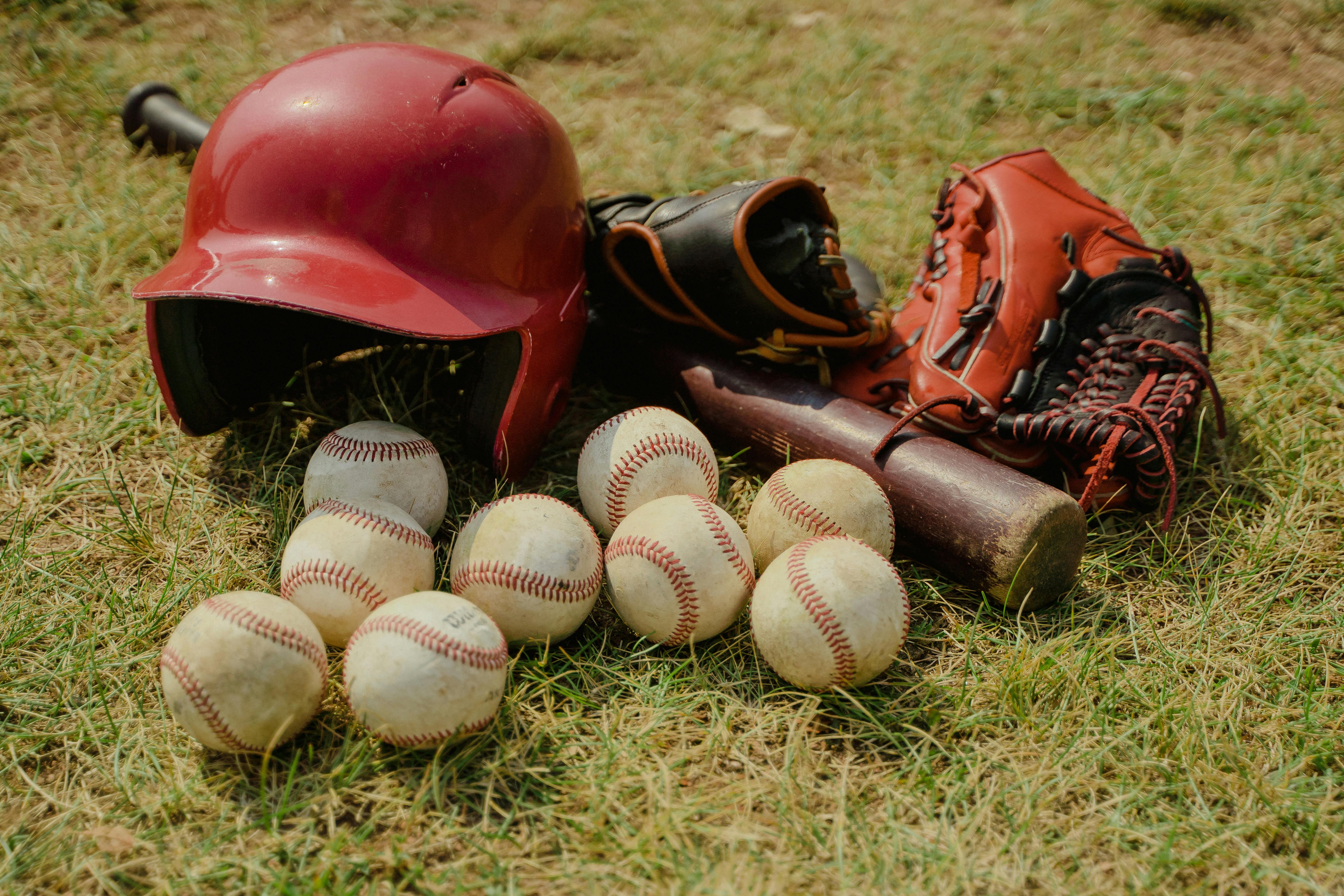 Baseball shoes, glove, bat and balls