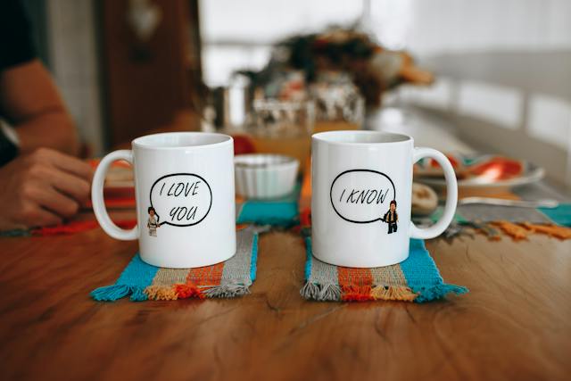 Two white mugs with inscriptions