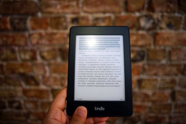 Turned on e-book in hand