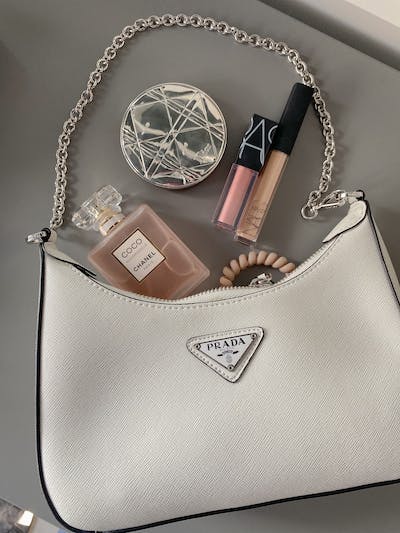 White bag, cosmetics and perfume