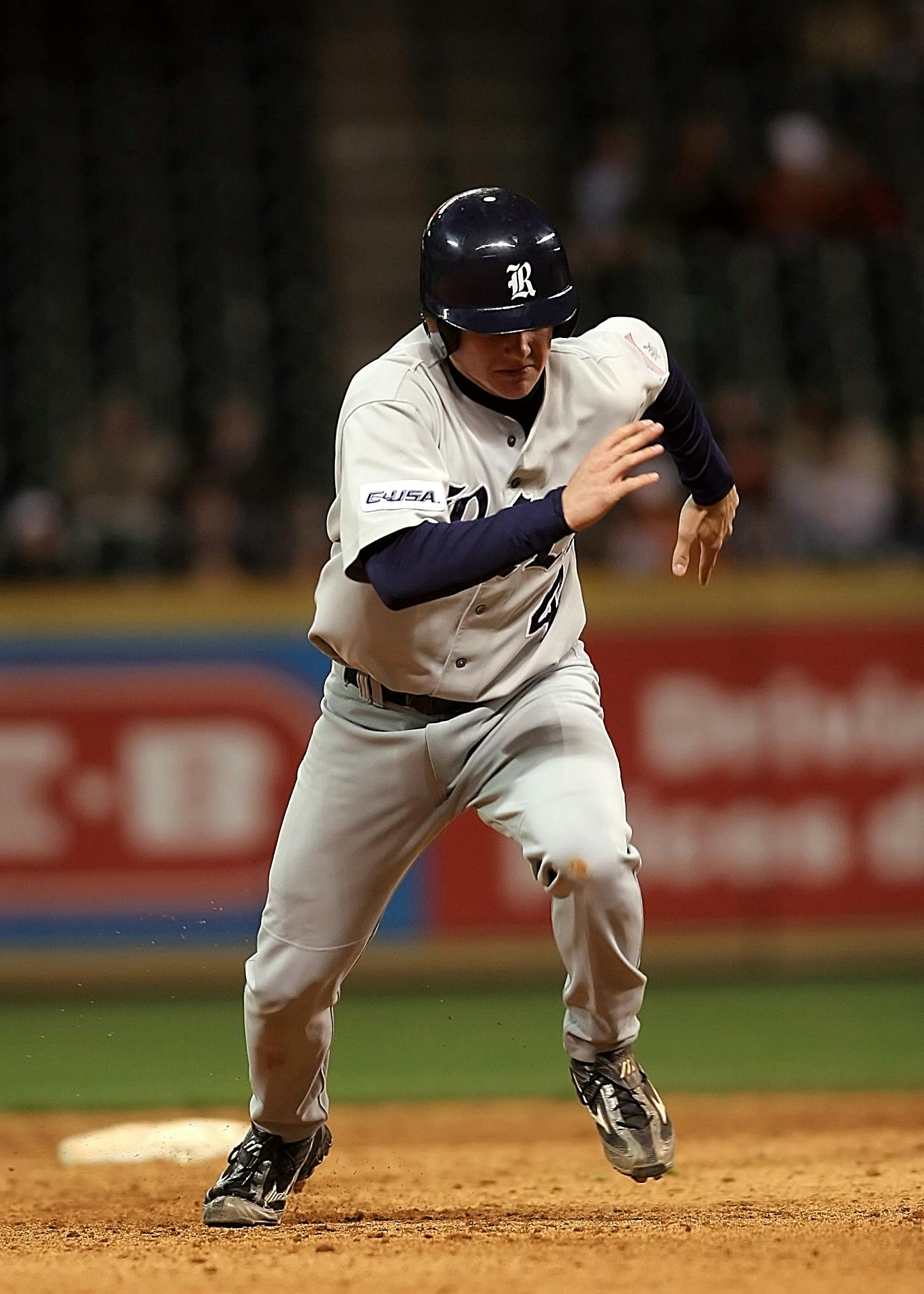 Baseball player running across the playing field