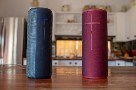 Red and blue wireless speakers on the table