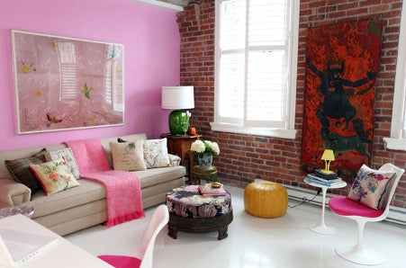  Furnished room with one pink wall and one brick wall