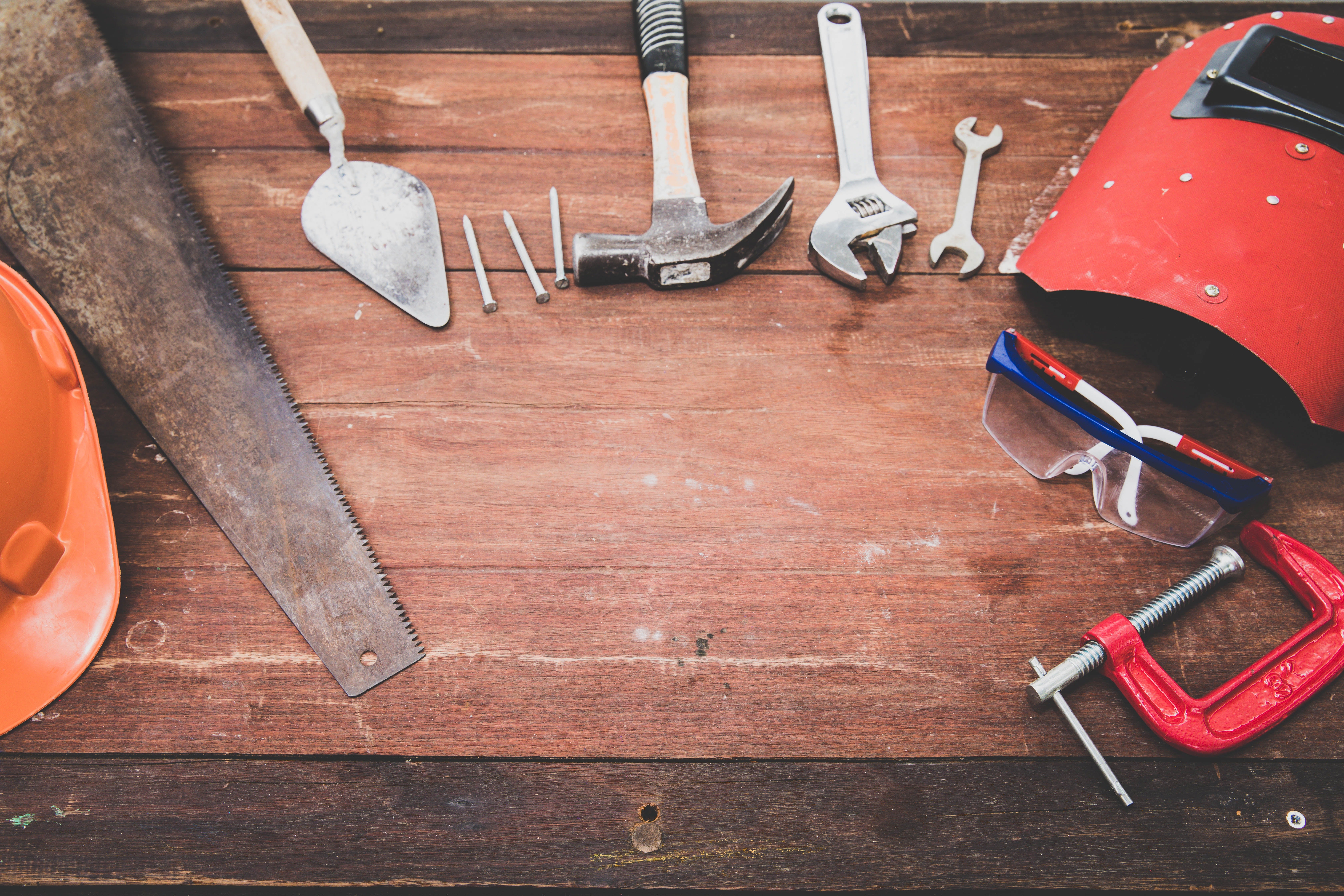 A set of tools on a wooden surface