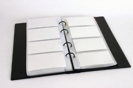 Opened business card holder with black cover on white background
