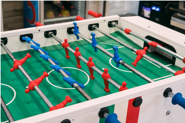 Table soccer with red and blue figures