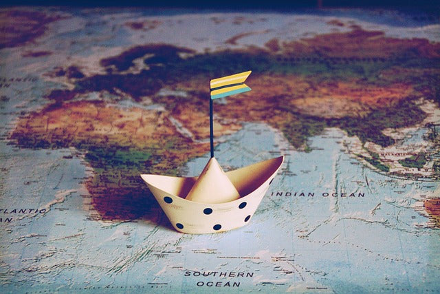 Paper boat is on the world map