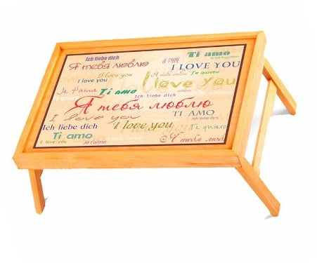 Wooden breakfast table with many inscriptions on different languages