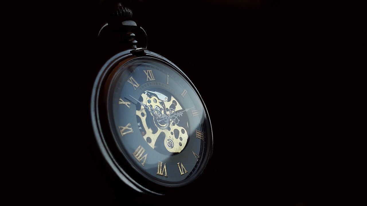 Pocket watch on black background